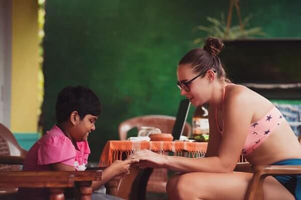 Women teaching a child